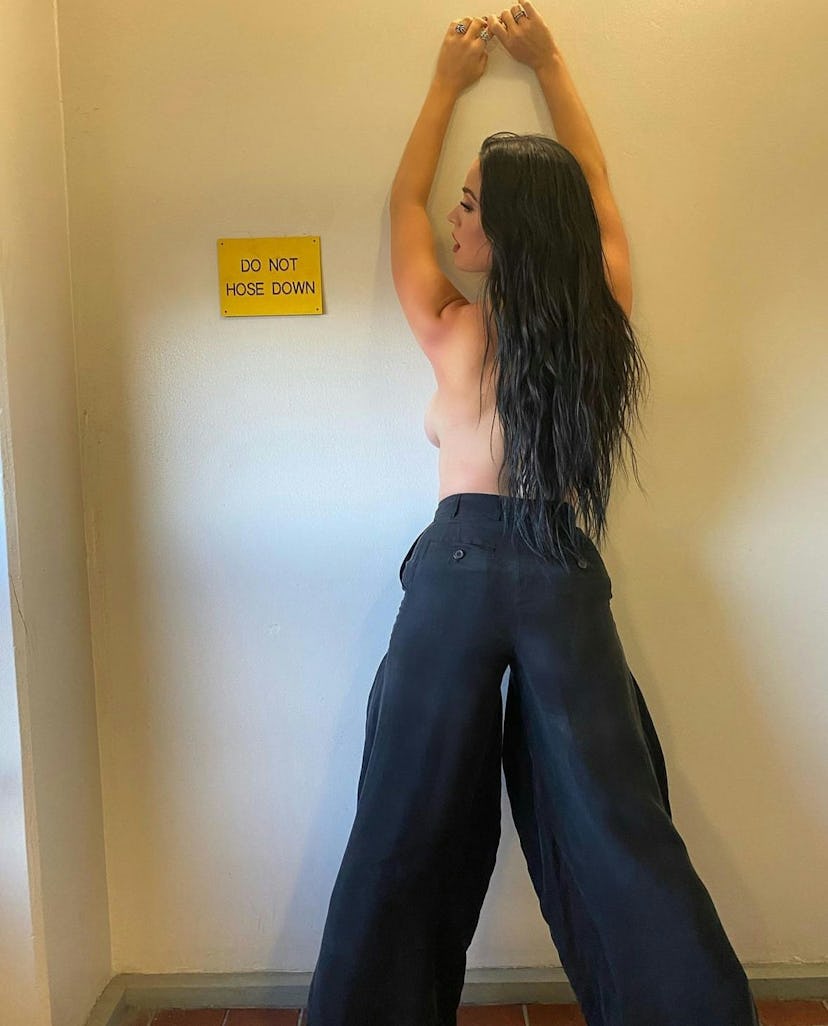 Katy Perry wearing a shirtless trouser look on Instagram.