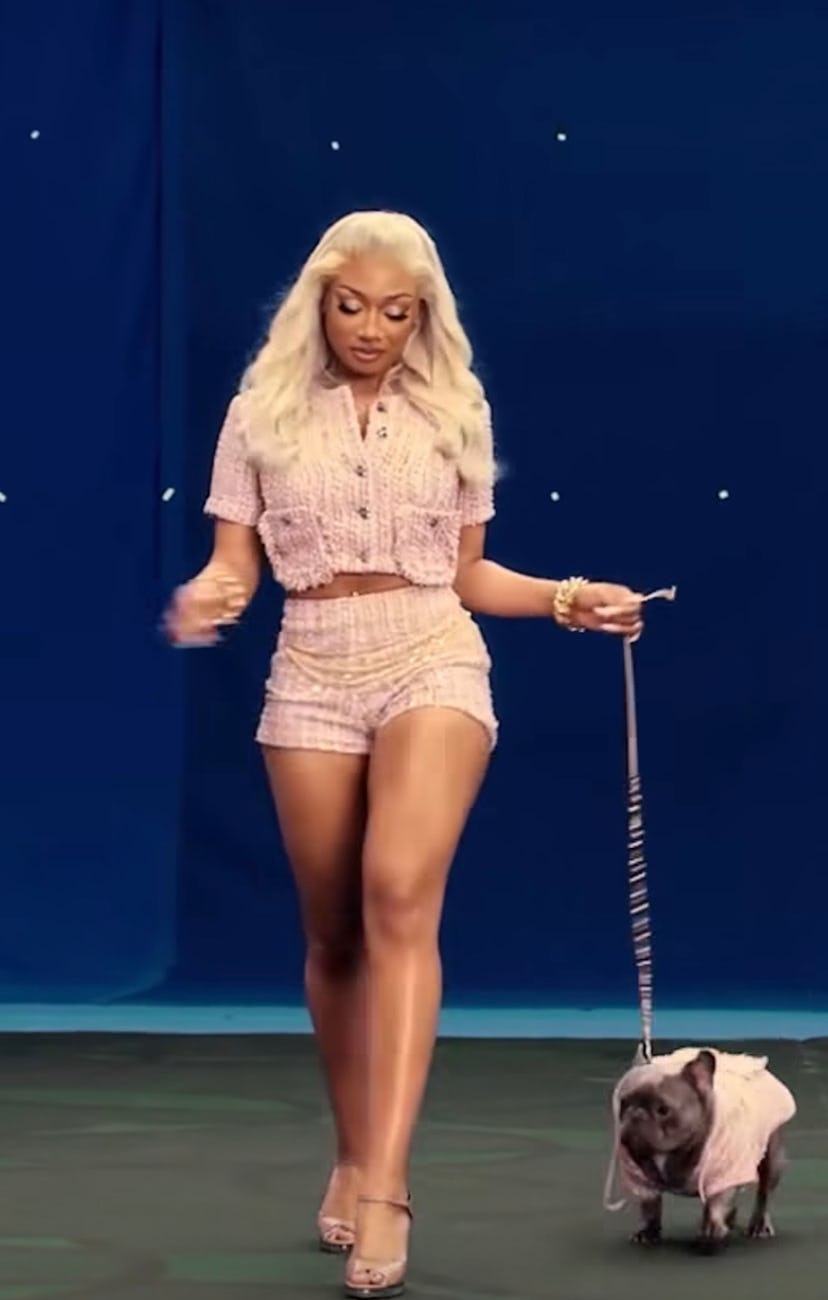 Megan Thee Stallion wears a pink tweed shorts set with her Frenchie, 4oe.
