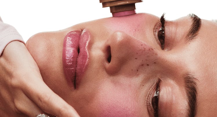 Hailey Bieber applies the Pocket Blush