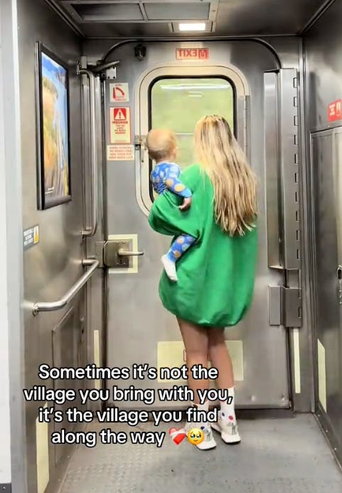 A woman in a green oversized sweater carries a child as they walk toward a train door. The scene conveys warmth and connection. Text overlay shares an inspiring message about community.