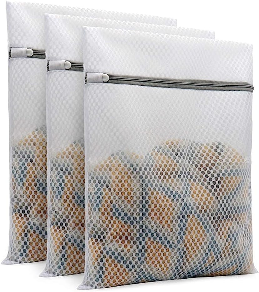 Three transparent zipper pouches with a mesh design, filled with assorted small items. Ideal for sto...