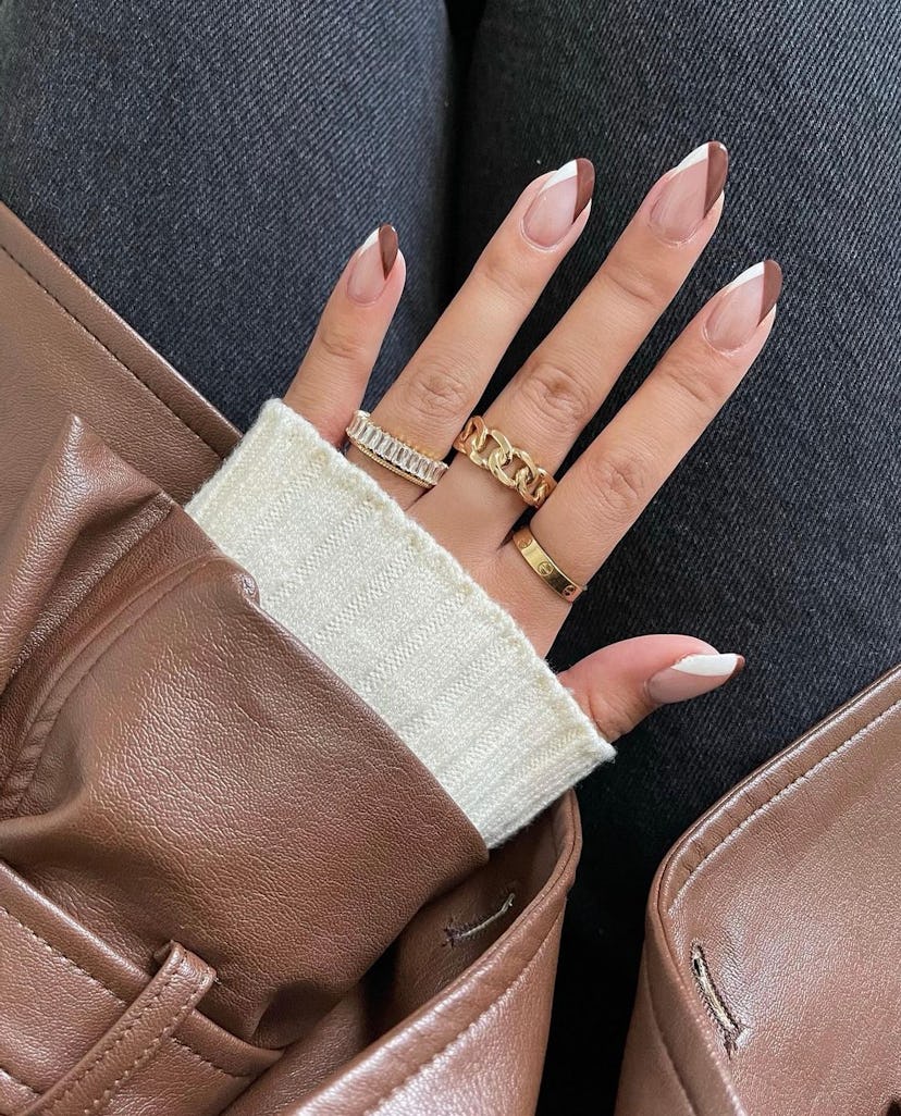 Brown V-tip French nails are on-trend for fall 2024.