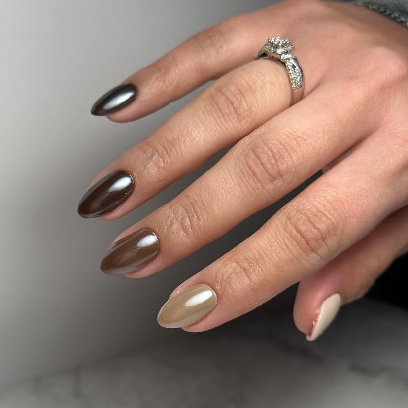 Brown chrome Skittle nails are on-trend for fall 2024.