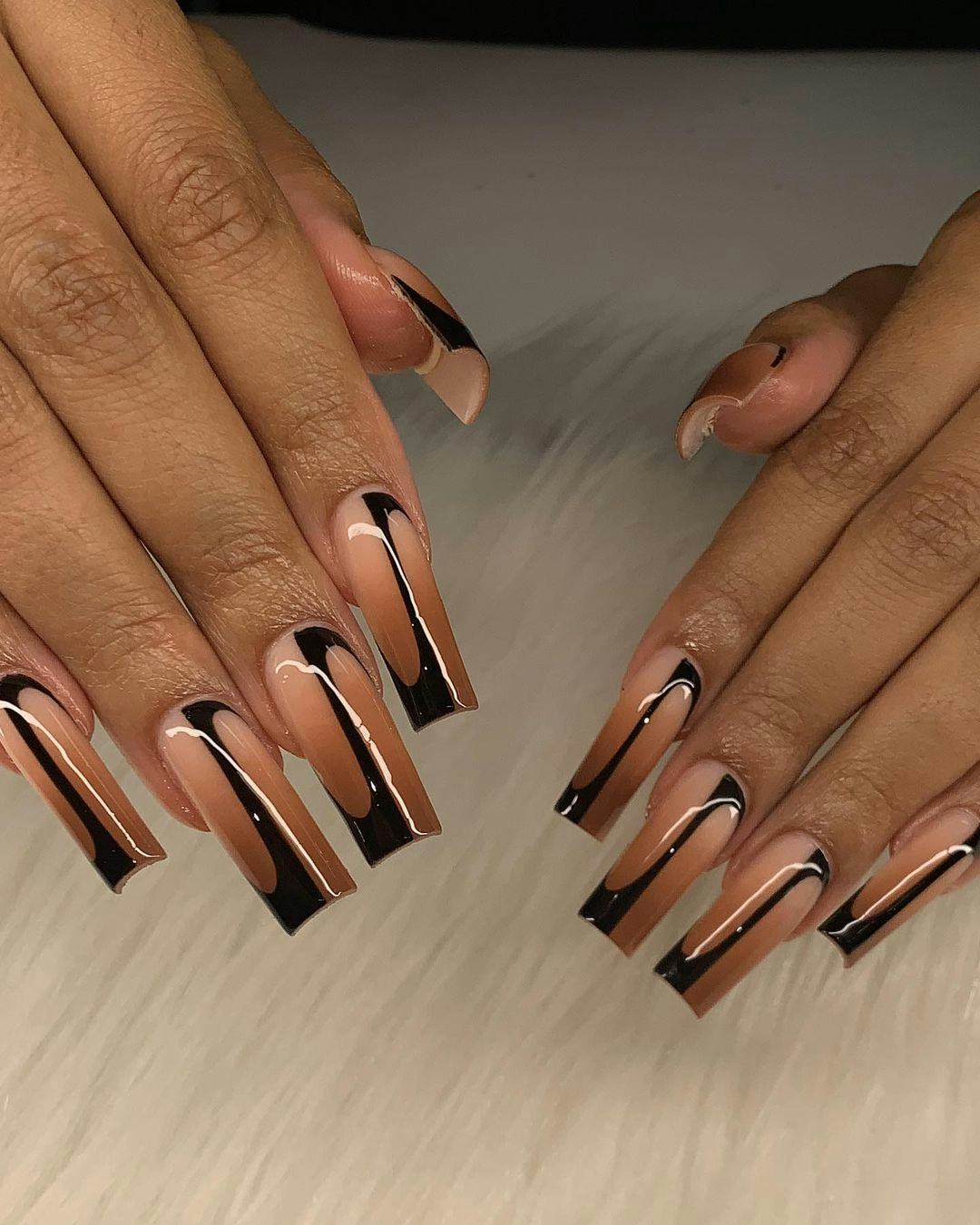 Brown ombré nails are on-trend for fall 2024.