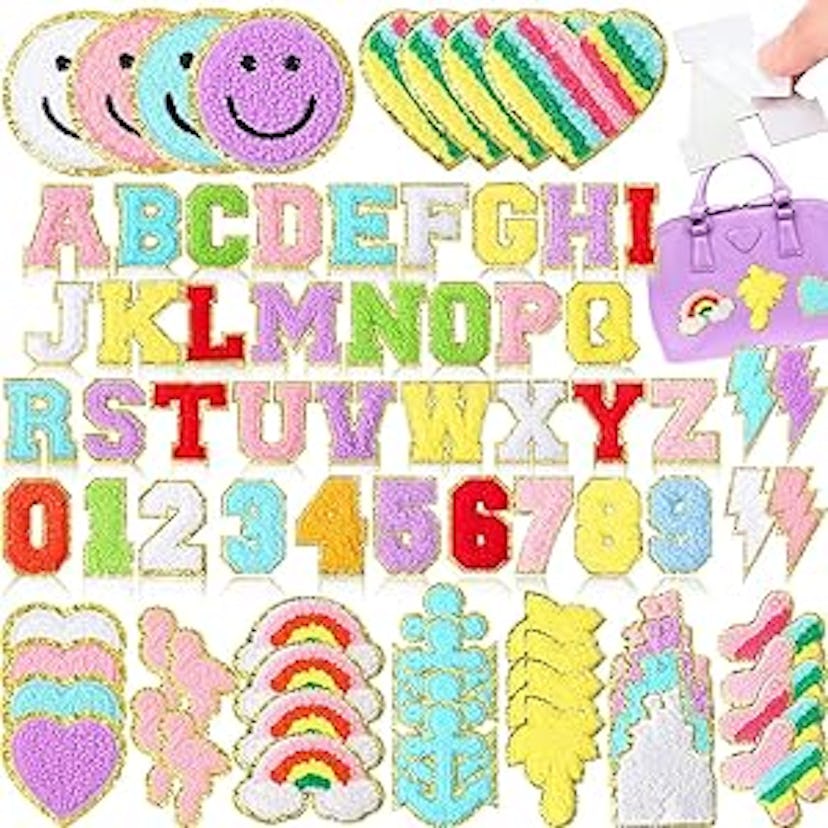 A colorful assortment of stickers featuring letters, numbers, smiley faces, hearts, rainbows, and va...