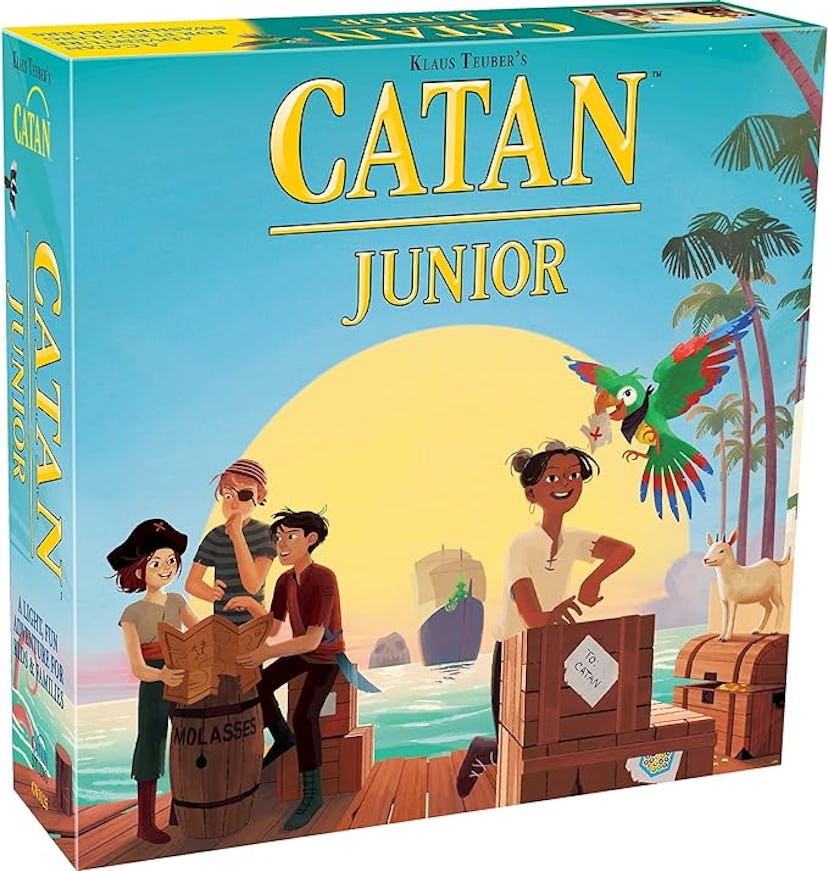 Colorful board game box for "Catan Junior," featuring animated characters on a beach with a parrot, ...