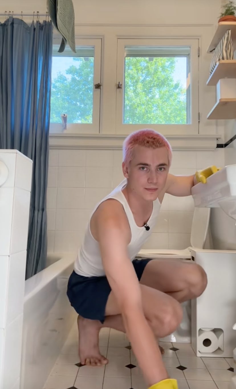 William cleaning their bathroom.