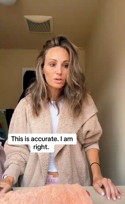 A woman with wavy hair is standing in a room, wearing a cozy beige cardigan. She looks serious, with a text overlay stating, "This is accurate. I am right."