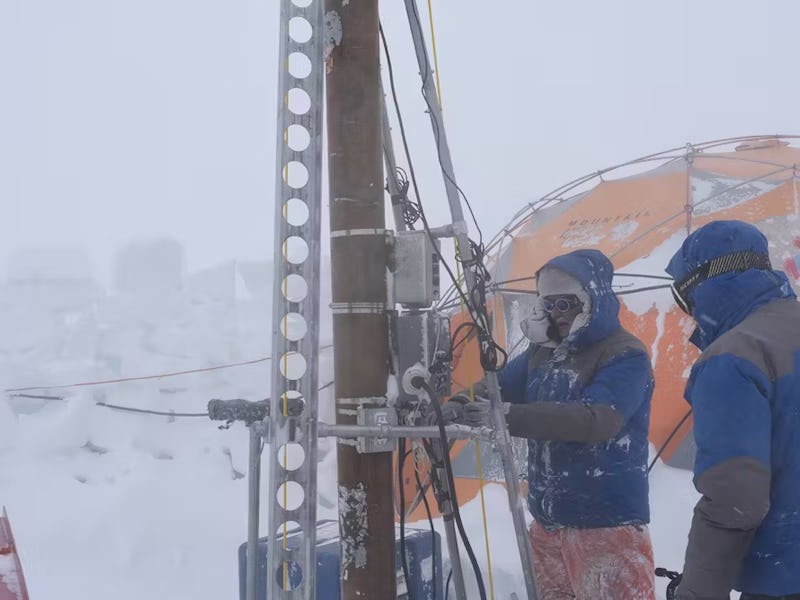 The researchers drilling on the Guliya Glacier.