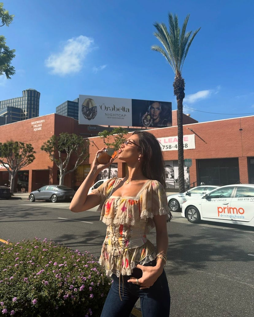 Bella Hadid’s corset blouse and flared boot cut jeans were so Y2K-coded.