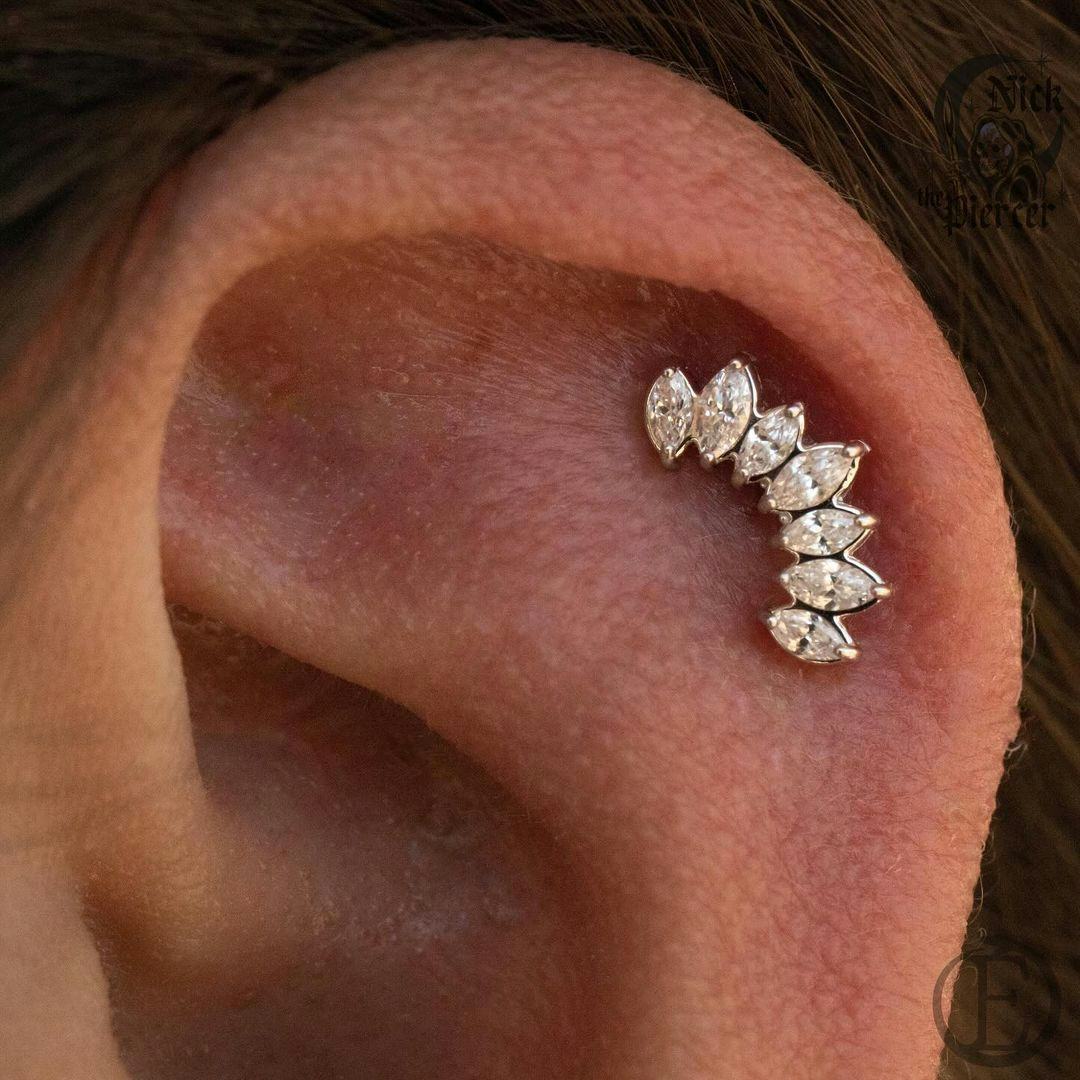 Flat helix piercings are on-trend for fall 2024.