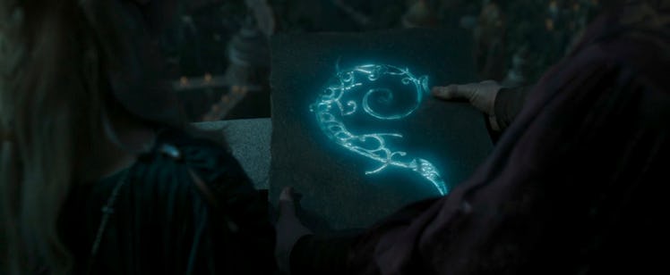 Ithildin shines on a stone tablet in 'The Lord of the Rings: The Rings of Power' Season 2, Episode 2