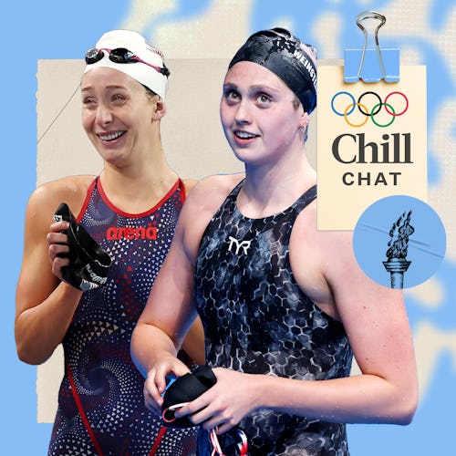 Two female swimmers smile on a light blue background. They wear competitive swim gear and hold their…