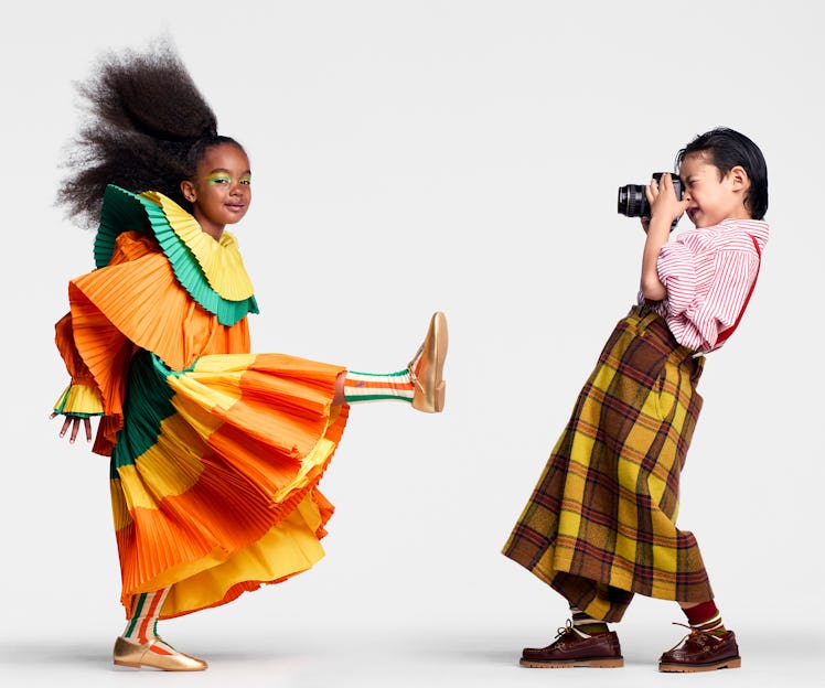 Awa wears a Bode dress; Bobo Choses socks; La Coqueta Kids shoes; her own earrings (throughout). Eri...