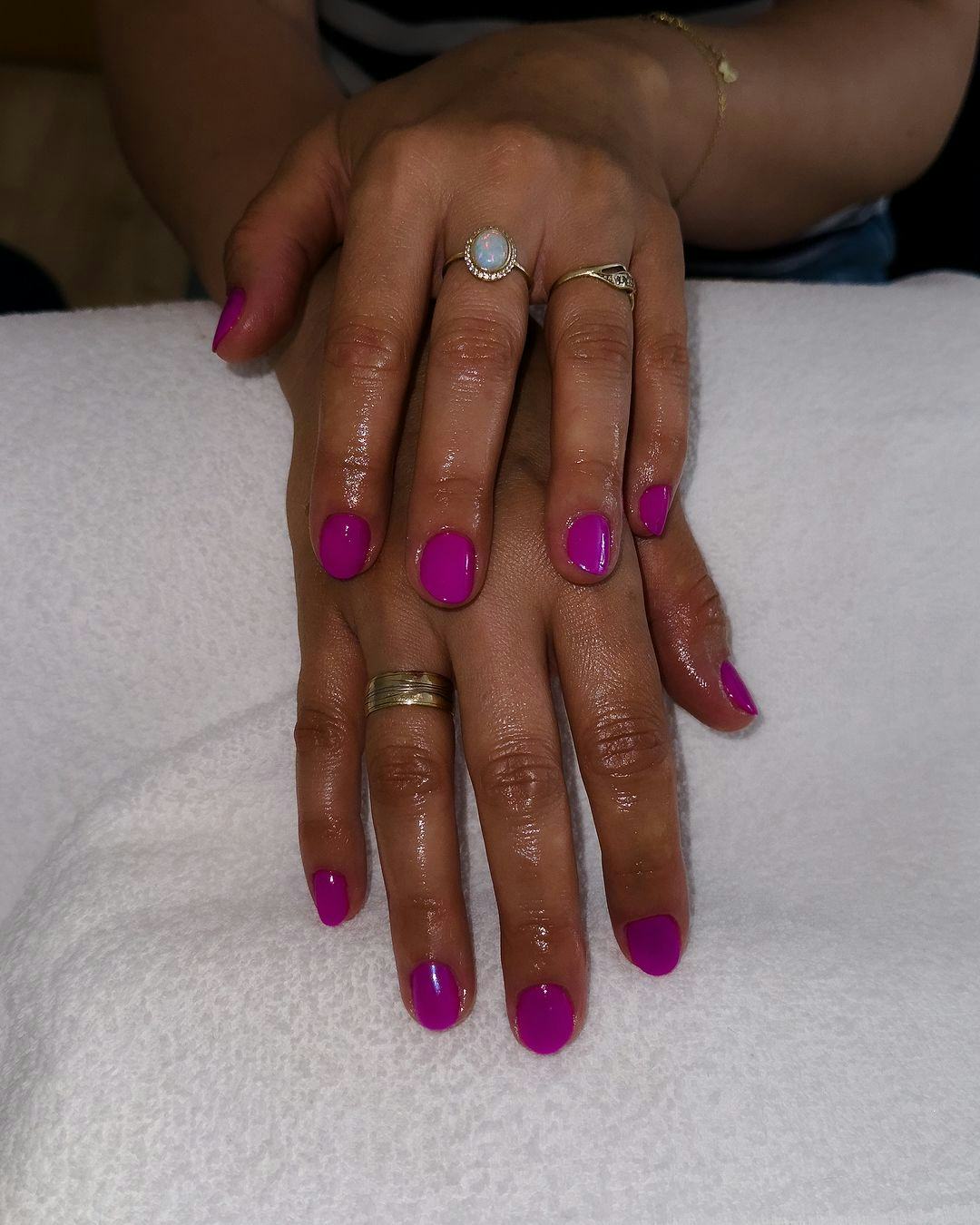 Bright magenta polish shades are on-trend for fall 2024.