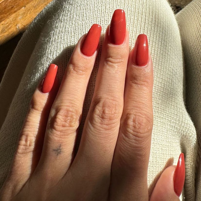 Brick red polish shades are on-trend for fall 2024.