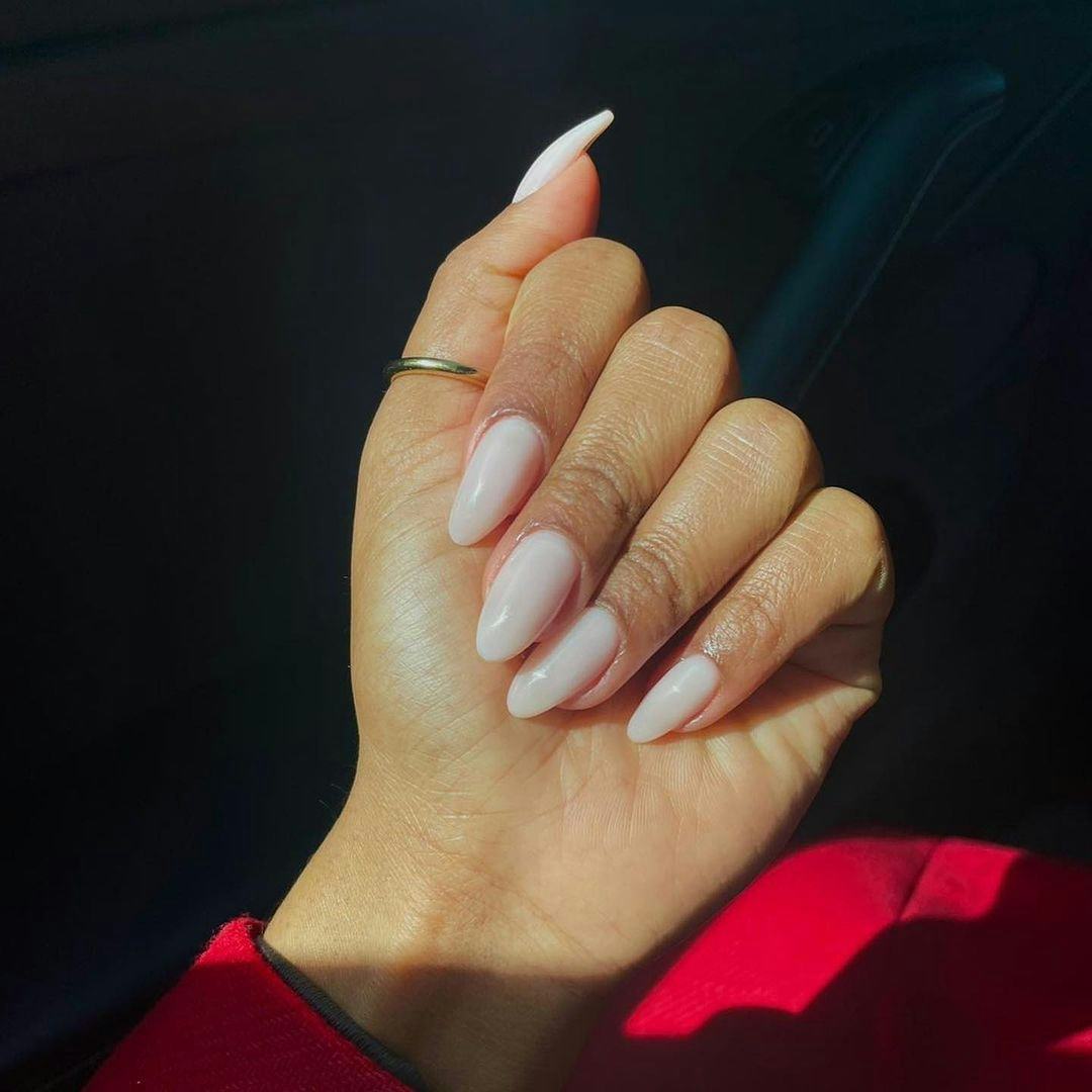 Milky sheer white polish shades are on-trend for fall 2024.