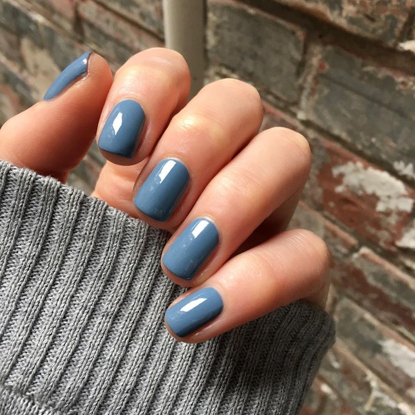 Dusty blue polish shades are on-trend for fall 2024.