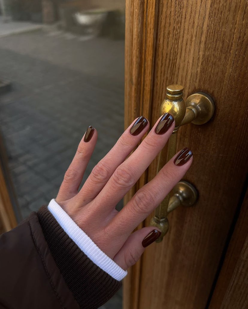 Chocolate brown polish shades are on-trend for fall 2024.