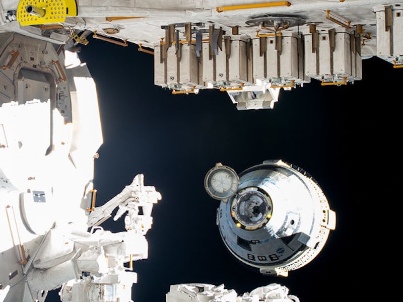 Boeing's uncrewed Starliner spaceraft backs away from the International Space Station moments after ...