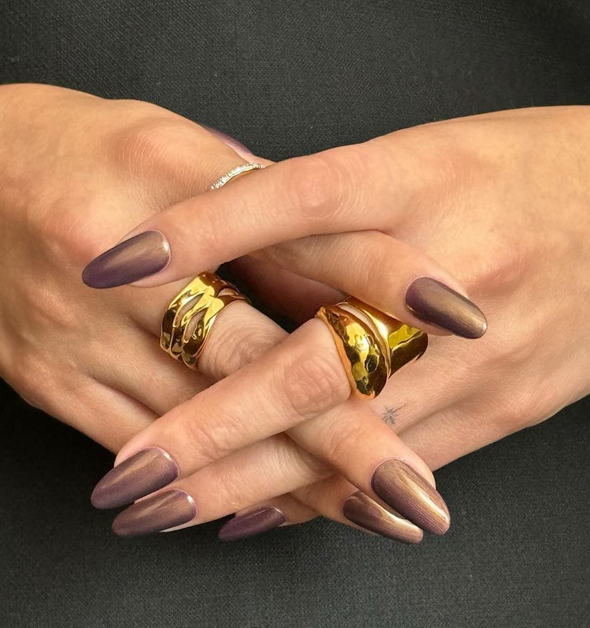 Selena Gomez wore “bronze plum chrome” nails to the premiere of her newest film, ‘Emilia Pérez.'