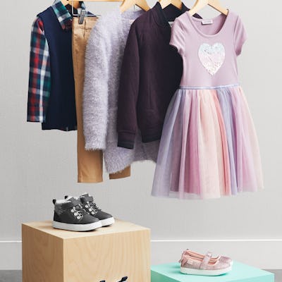A picture of a wardrobe of new, curated children's clothes.