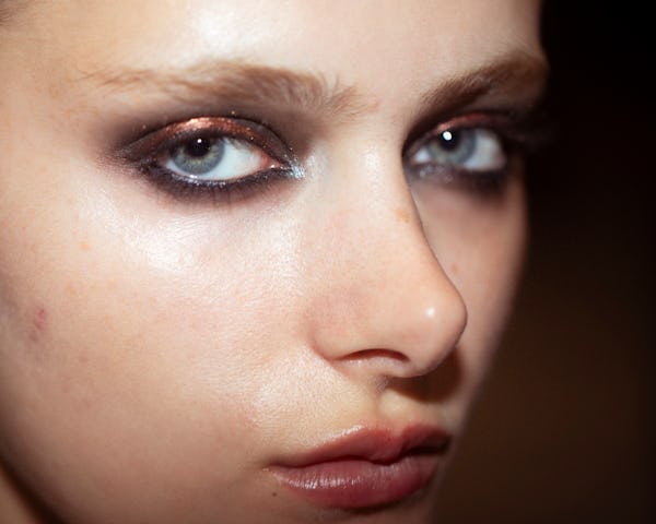 Chrome smoky eyes at Christian Siriano.