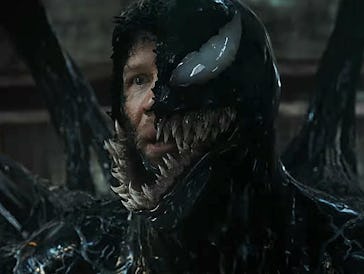 A close-up of a character with a menacing black symbiote covering their face, featuring sharp teeth ...