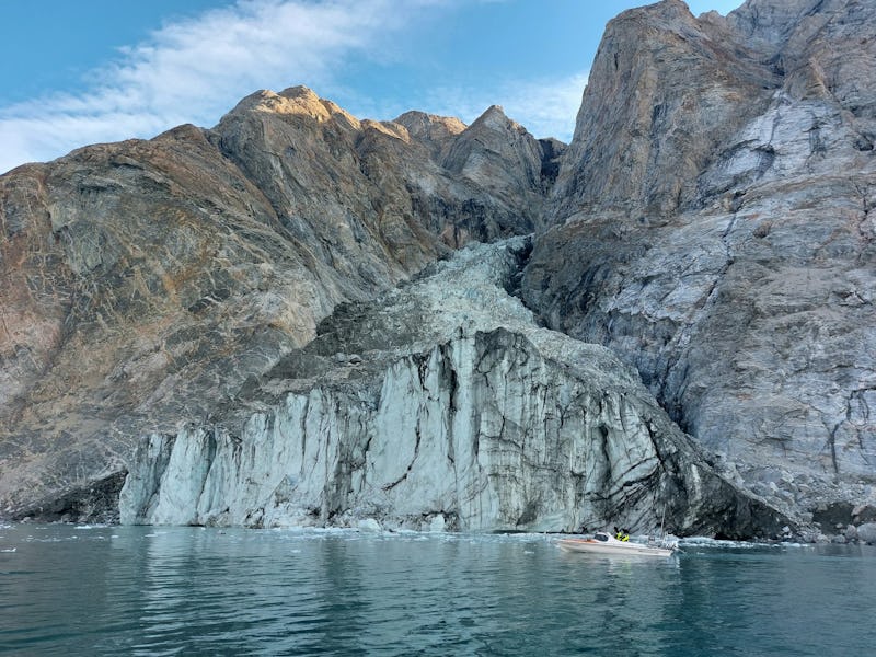 Dickson Fjord in August 2023. Just a few weeks later, a large chunk of the mountain would slide into...