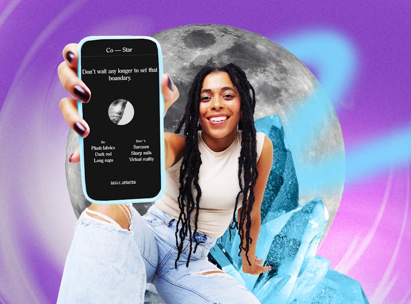 A person with long, curly hair smiles while holding a phone displaying a horoscope app, against a co...