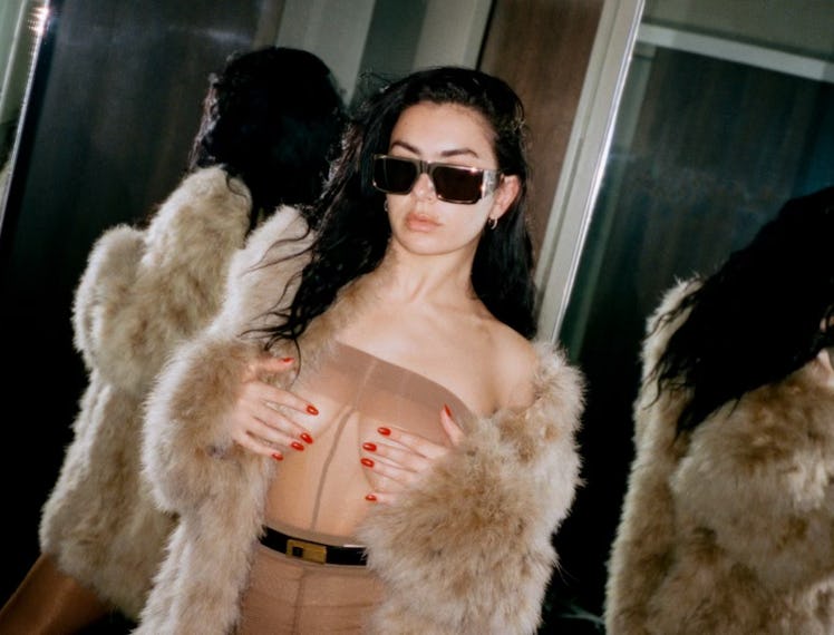 Charli XCX in a sheer Saint Laurent dress.