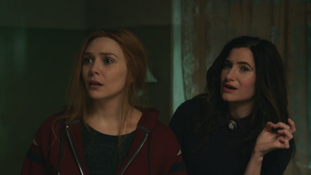 (L-R): Elizabeth Olsen as Wanda Maximoff and Kathryn Hahn as Agatha Harkness in Marvel Studios' 'Wan...