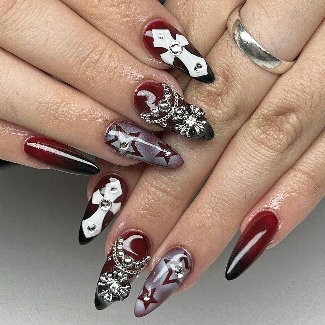Cherry mocha nails with goth girl-inspired adornments are on-trend for fall 2024.