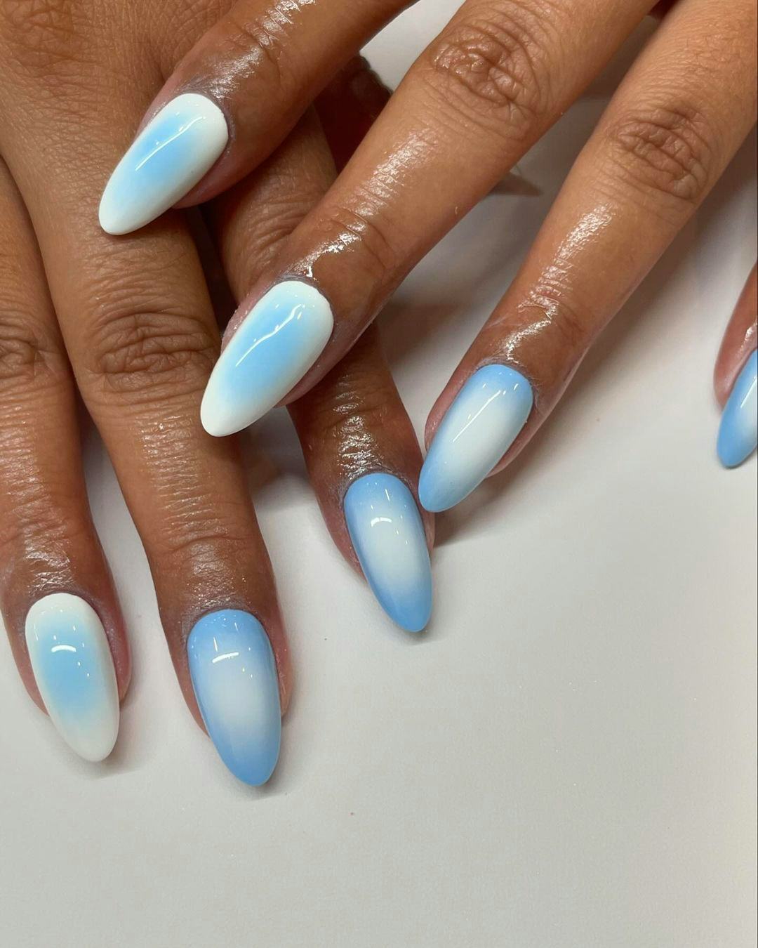 Cancer would wear white and light blue aura nails.