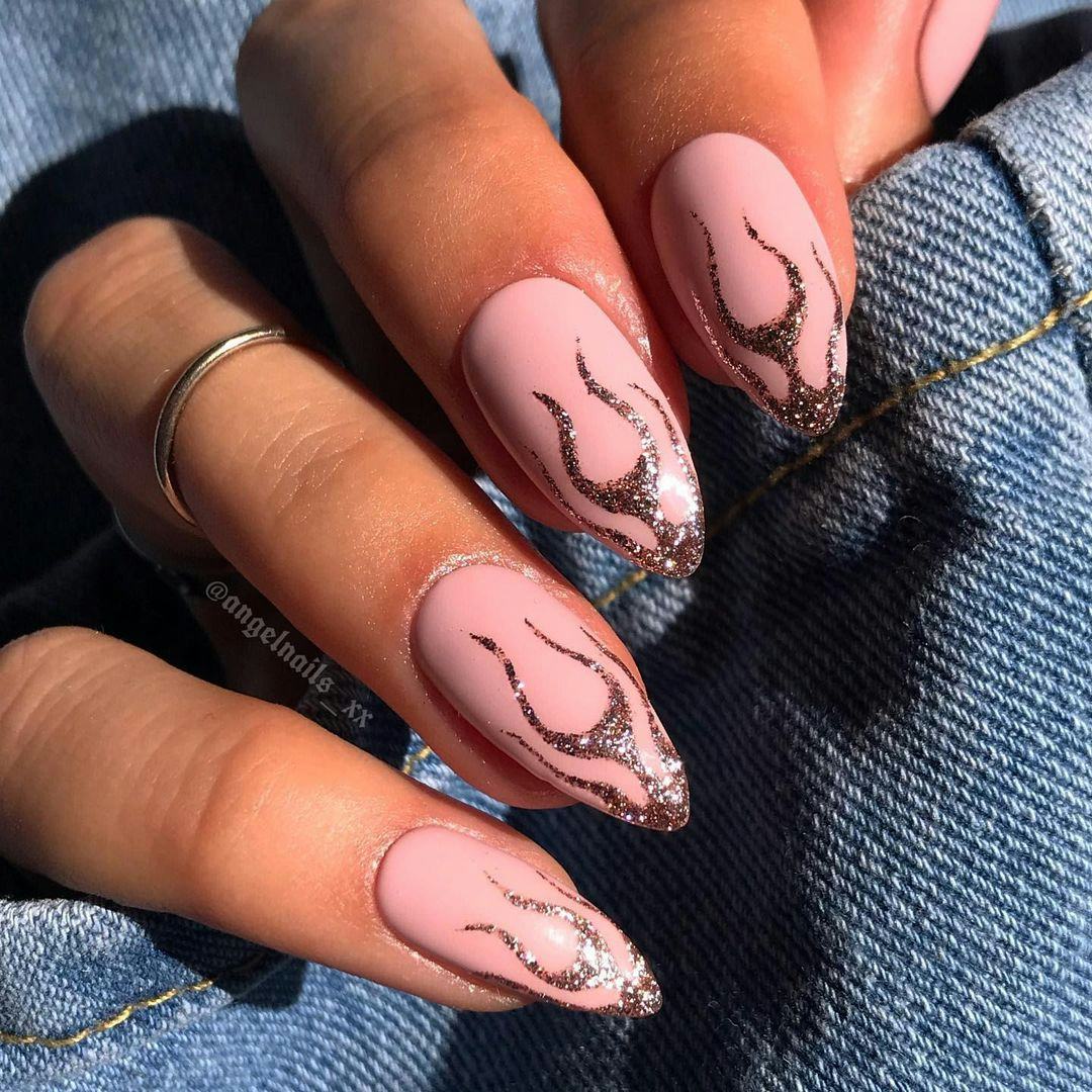 Try nails with rose gold flame designs.