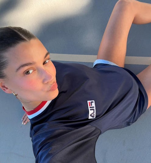 Hailey Bieber just shared her new dark sapphire blue manicure (and it's *so* boy mom-coded).