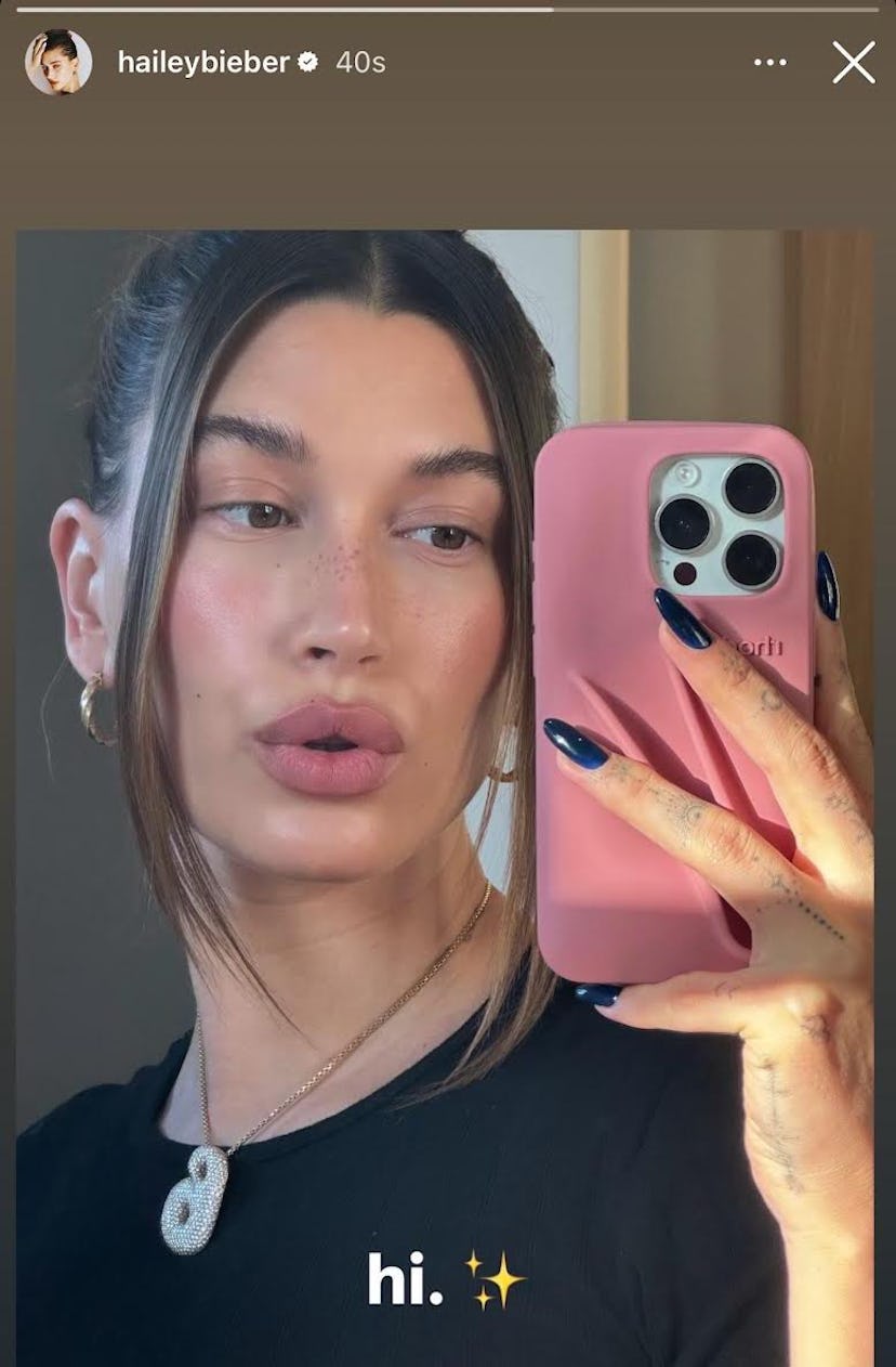 Hailey Bieber shared a snap of her newest dark sapphire blue manicure.