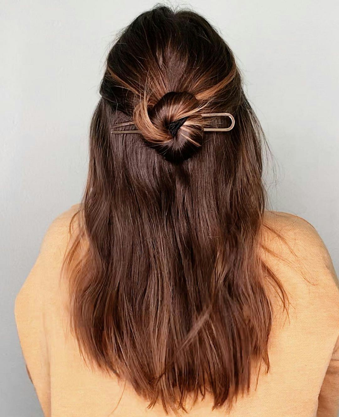 Use a French pin to create a half-up hairdo.