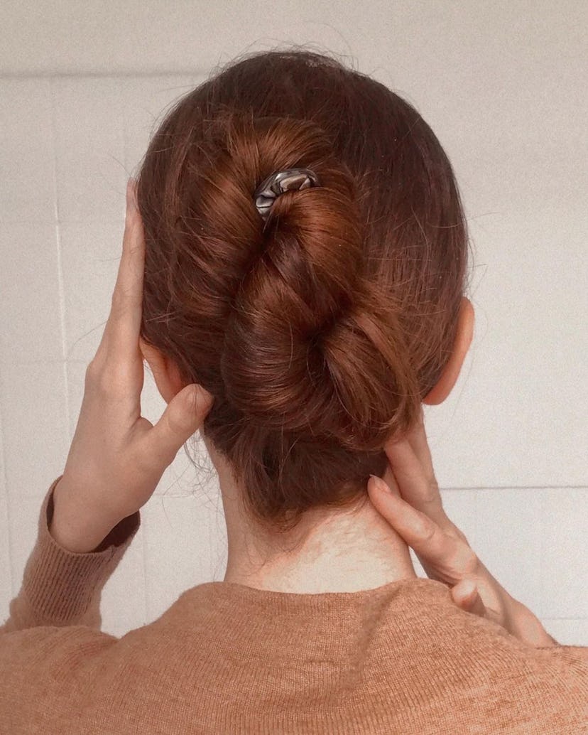 Create a French twist with a French hair pin.