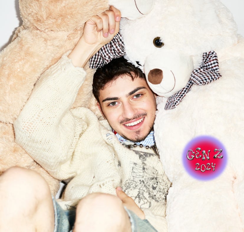 Harry Daniels posing with stuffed teddy bears.