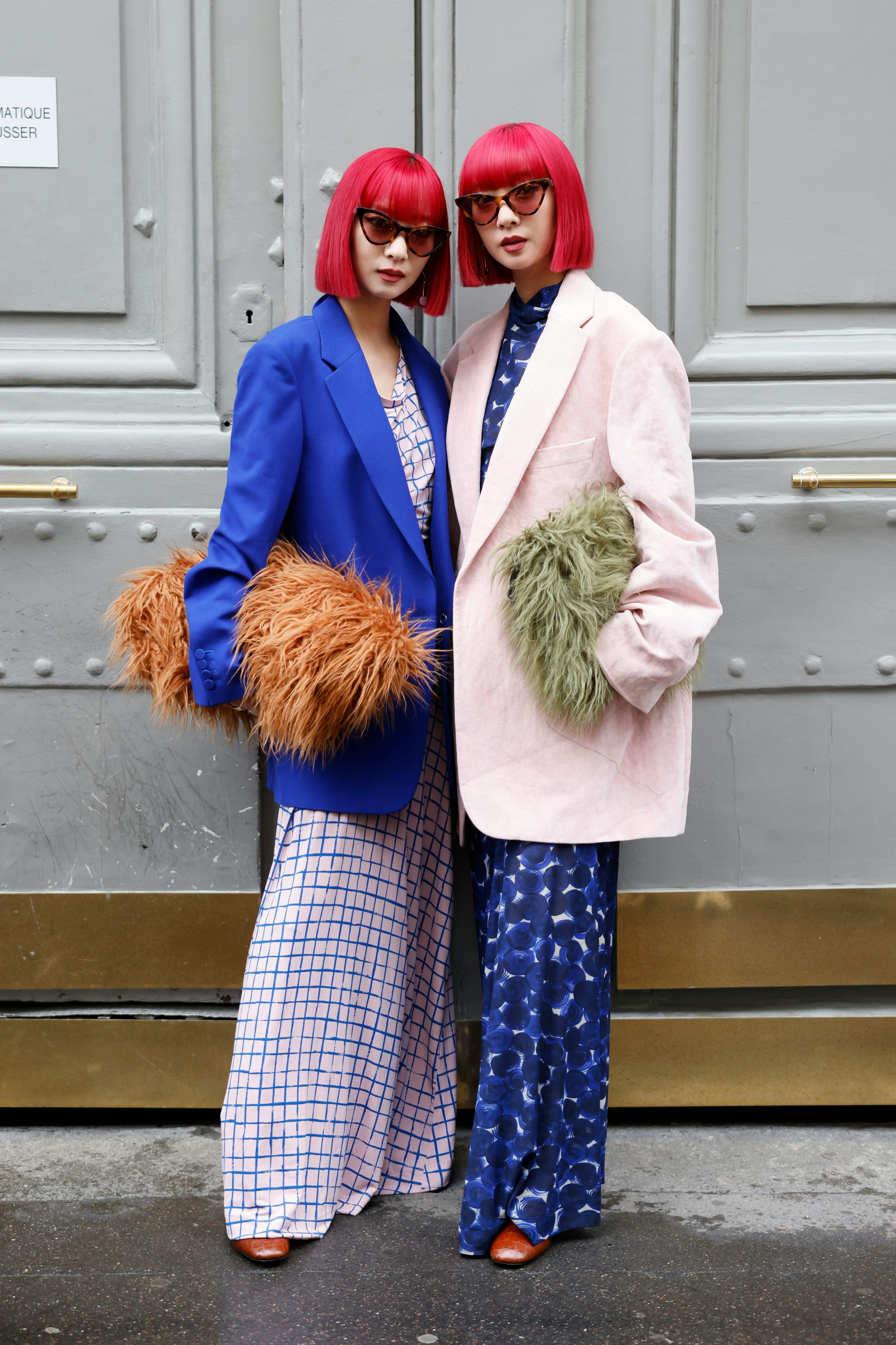 PARIS, FRANCE - SEPTEMBER 25: Amy and Aya Suzuki wear pink and blue checked maxi dress, blue blazer,...
