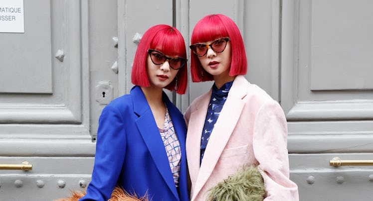 PARIS, FRANCE - SEPTEMBER 25: Amy and Aya Suzuki wear pink and blue checked maxi dress, blue blazer,...