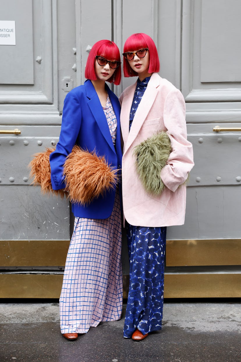 PARIS, FRANCE - SEPTEMBER 25: Amy and Aya Suzuki wear pink and blue checked maxi dress, blue blazer,...