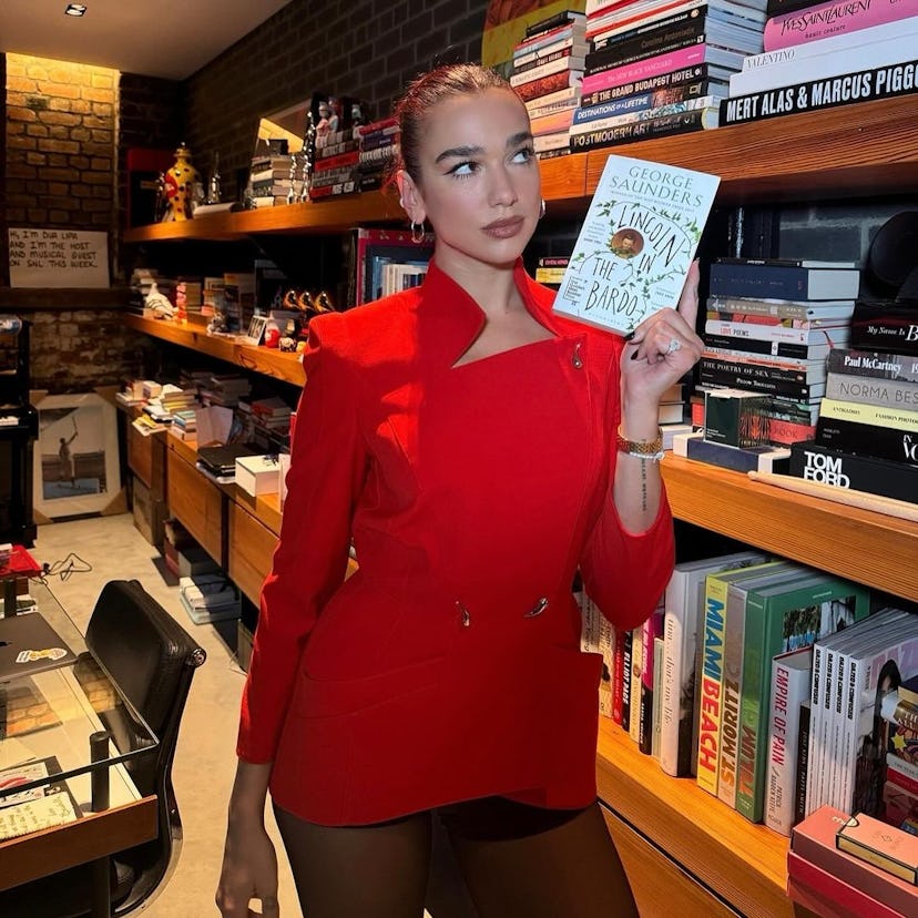 Dua Lipa in a red vintage Mugler jacket.