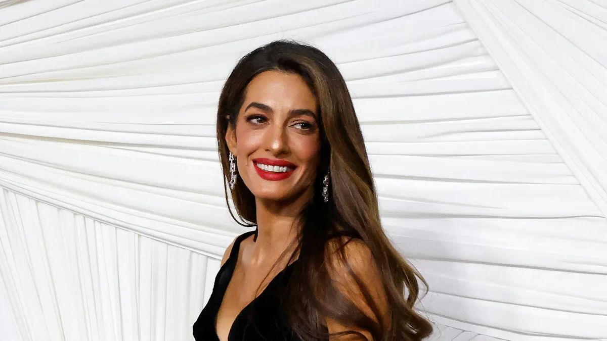 Amal Clooney's Plunging Velvet Gown and Red Lip Are Old Hollywood Personified Amal Clooney's Plunging Velvet Gown and Red Lip Are Old Hollywood Personified