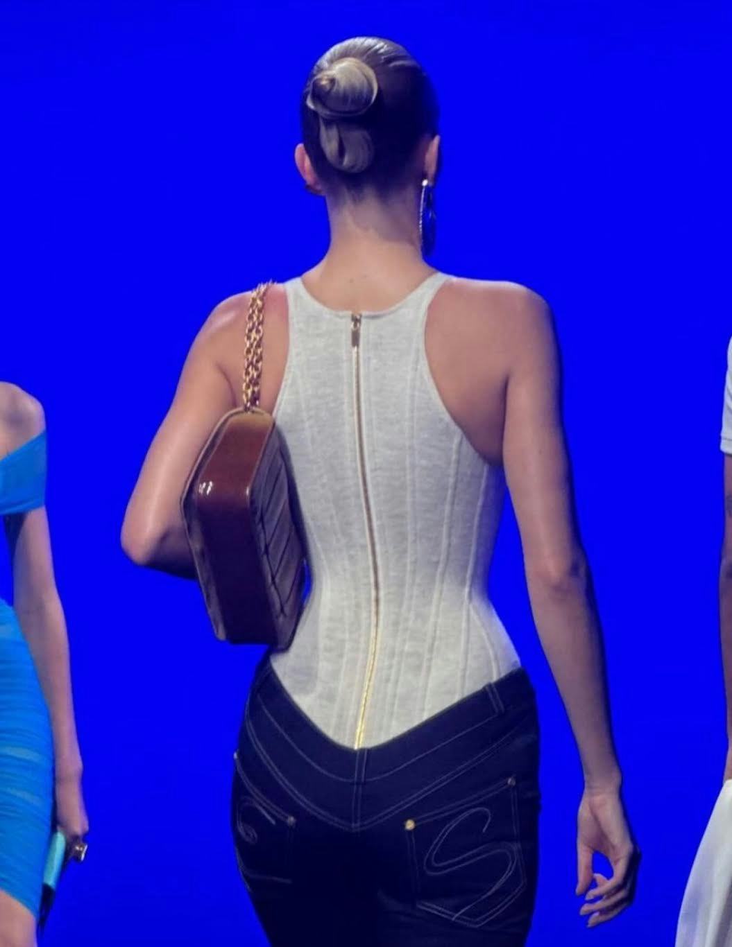 Slicked-back buns were spotted at Paris Fashion Week Spring/Summer 2025.