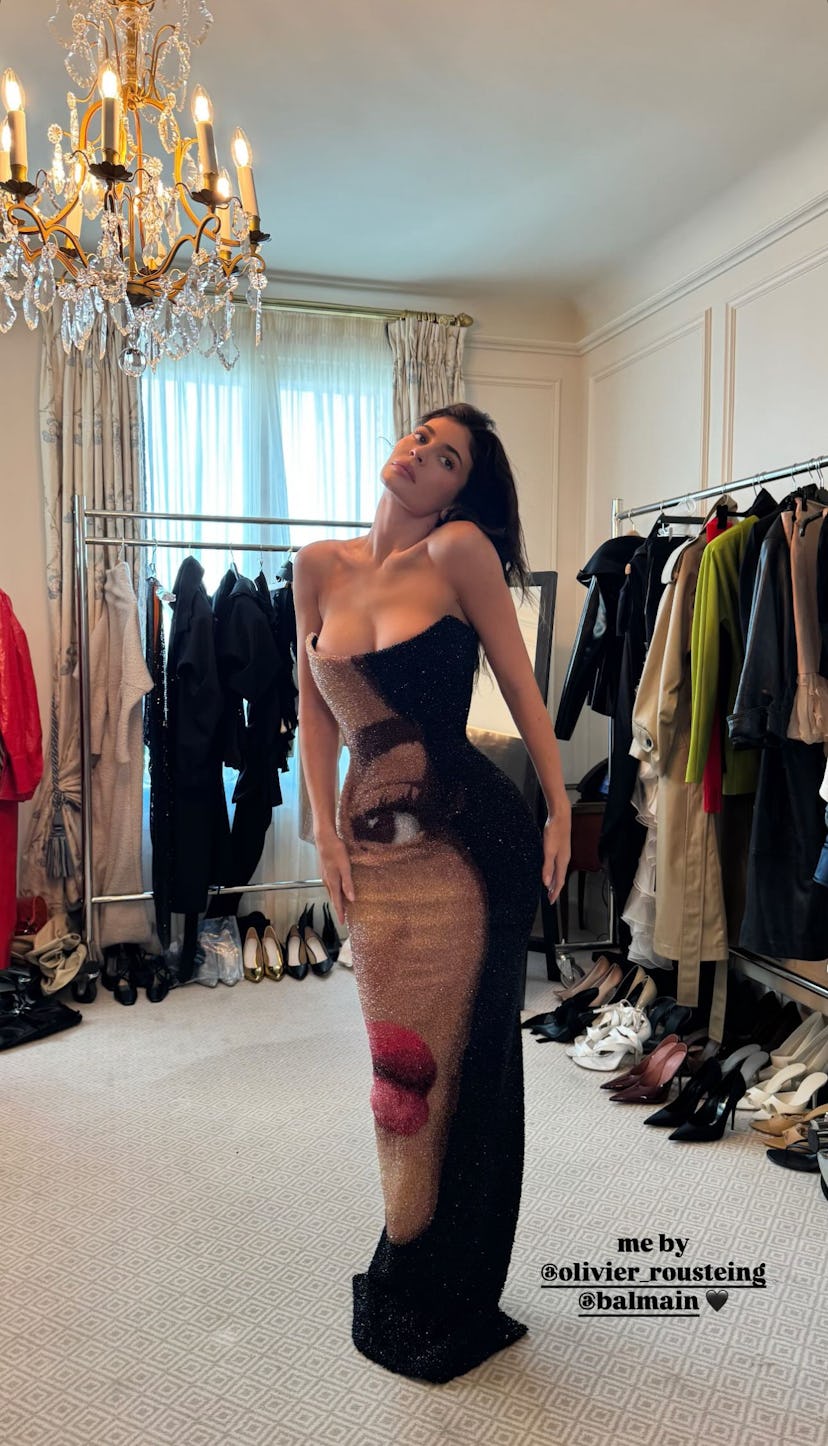 Kylie Jenner wears a Balmain dress with her face. 