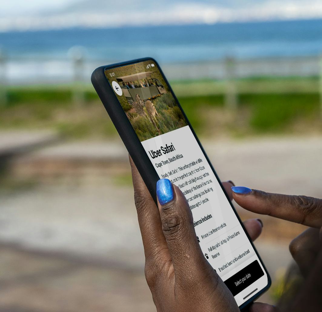A woman calls an Uber Safari from her phone.