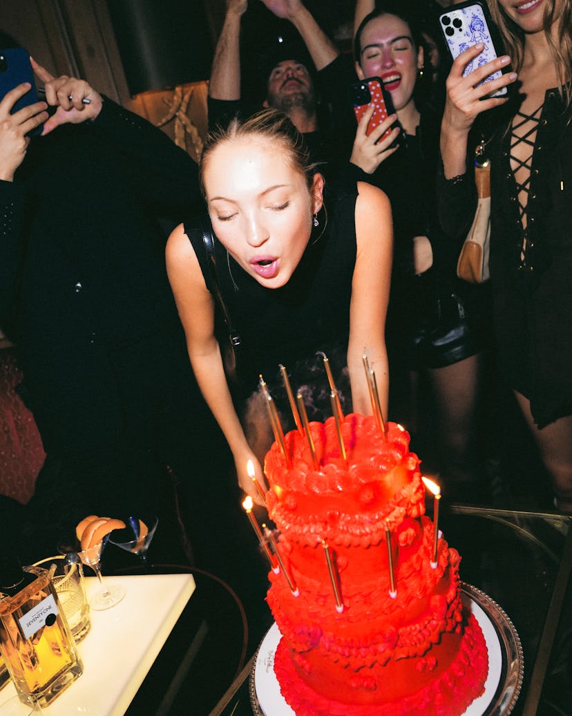 Lila Moss blowing out birthday cake candles