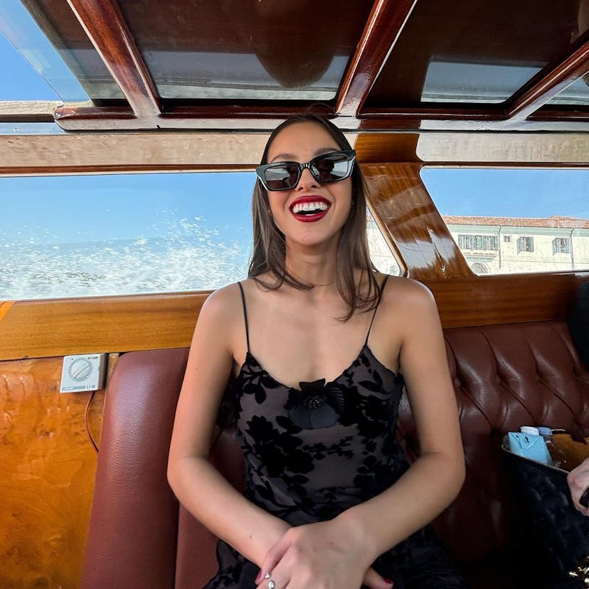 Olivia Rodrigo all smiles while on a boat in Venice, Italy.